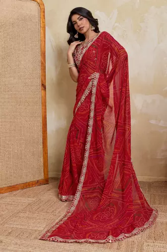 Catching red georgette bandhej print with cutwork lace border saree with mono banglory silk blouse