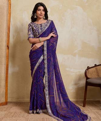 Delightful blue georgette bandhej print with cutwork lace border saree with mono banglory silk blouse 1