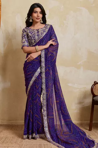 Delightful blue georgette bandhej print with cutwork lace border saree with mono banglory silk blouse
