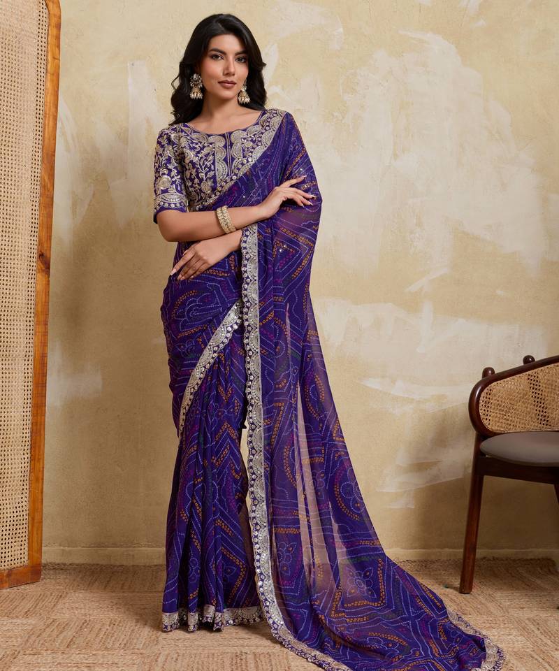 Delightful blue georgette bandhej print with cutwork lace border saree with mono banglory silk blouse