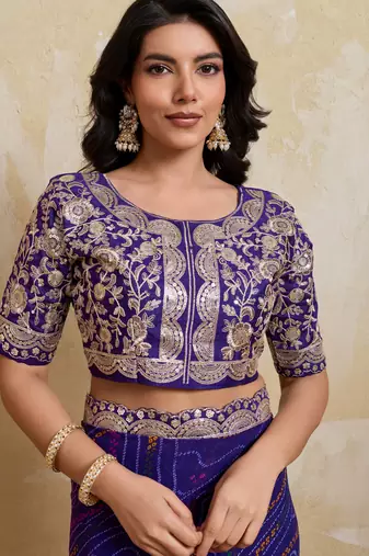 Delightful blue georgette bandhej print with cutwork lace border saree with mono banglory silk blouse