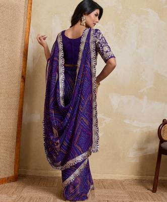 Delightful blue georgette bandhej print with cutwork lace border saree with mono banglory silk blouse 4