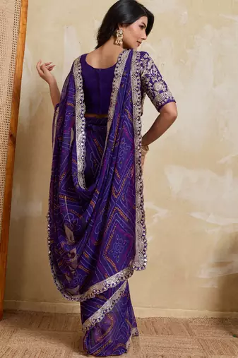 Delightful blue georgette bandhej print with cutwork lace border saree with mono banglory silk blouse