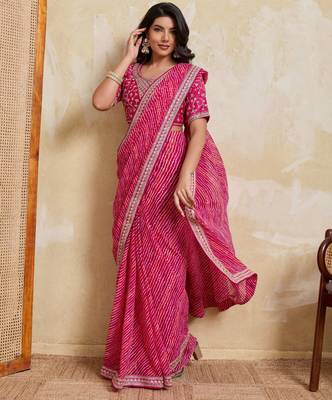 Bewitching pink georgette bandhej print with embroidery work lace border saree with mono banglory silk blouse 4