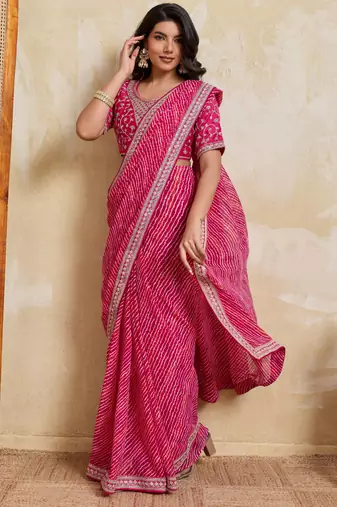 Bewitching pink georgette bandhej print with embroidery work lace border saree with mono banglory silk blouse