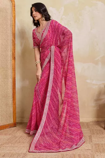 Bewitching pink georgette bandhej print with embroidery work lace border saree with mono banglory silk blouse