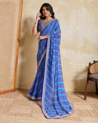 Fetching blue georgette bandhej print with embroidery work lace border saree with mono banglory silk blouse 1
