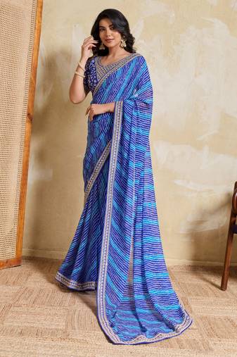 Fetching blue georgette bandhej print with embroidery work lace border saree with mono banglory silk blouse