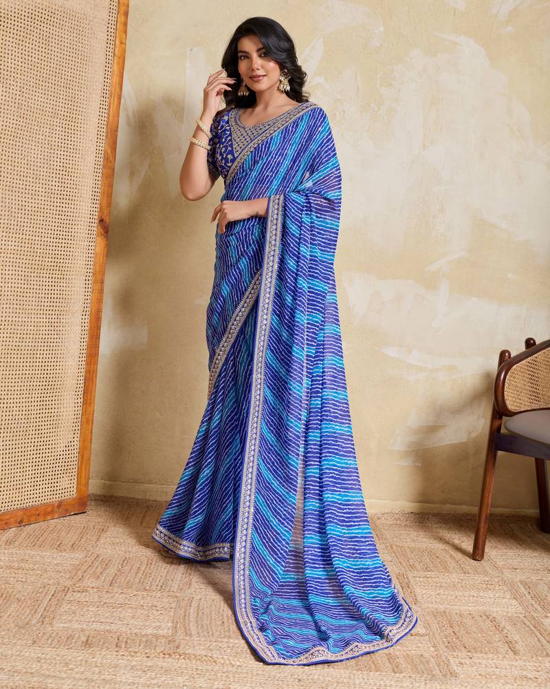 Fetching blue georgette bandhej print with embroidery work lace border saree with mono banglory silk blouse