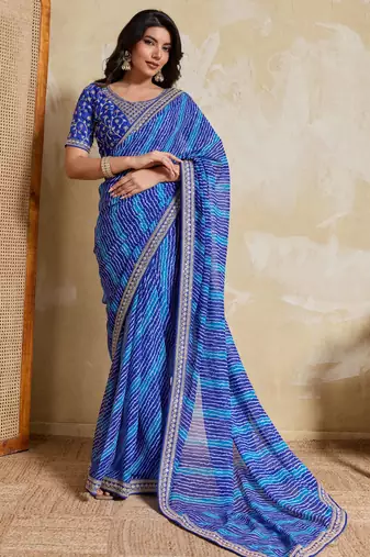 Fetching blue georgette bandhej print with embroidery work lace border saree with mono banglory silk blouse