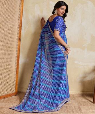 Fetching blue georgette bandhej print with embroidery work lace border saree with mono banglory silk blouse 4