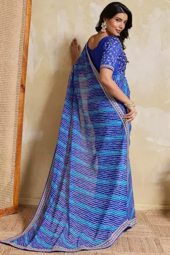 Fetching blue georgette bandhej print with embroidery work lace border saree with mono banglory silk blouse