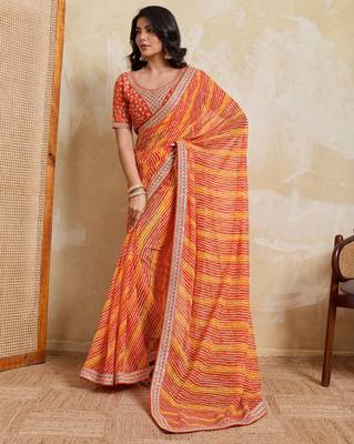 Glamourous orange georgette bandhej print with embroidery work lace border saree with mono banglory silk blouse 3