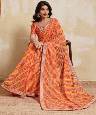 Glamourous orange georgette bandhej print with embroidery work lace border saree with mono banglory silk blouse 5