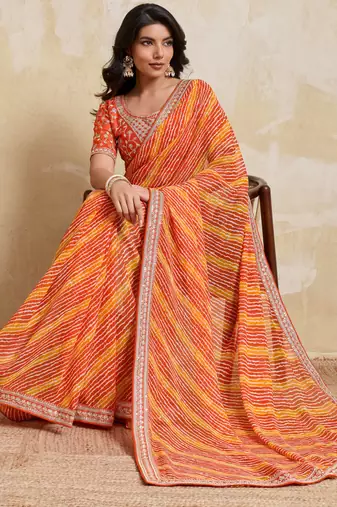 Glamourous orange georgette bandhej print with embroidery work lace border saree with mono banglory silk blouse