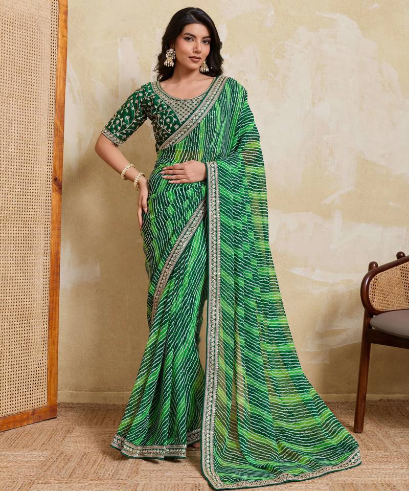 Glamorous green georgette bandhej print with embroidery work lace border saree with mono banglory silk blouse
