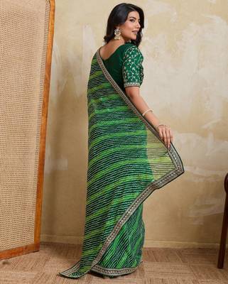 Glamorous green georgette bandhej print with embroidery work lace border saree with mono banglory silk blouse 4
