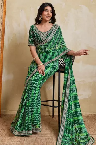 Glamorous green georgette bandhej print with embroidery work lace border saree with mono banglory silk blouse