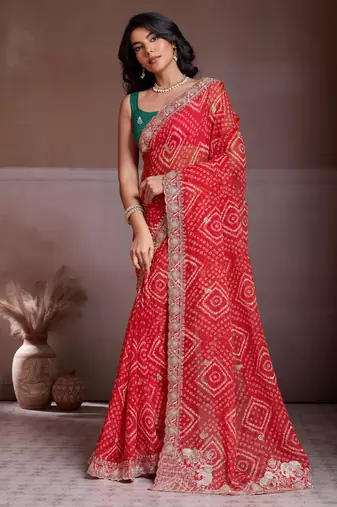 Delightfully red georgette bandhej print with cutwork lace border saree with mono banglory silk blouse