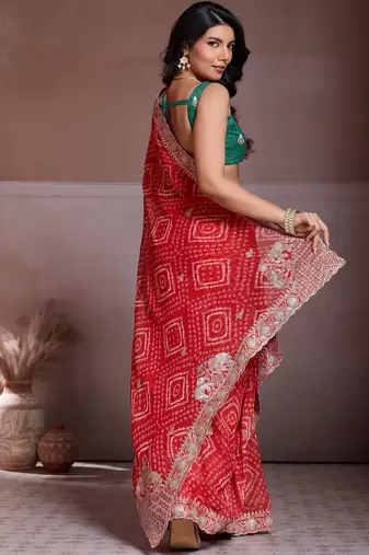 Delightfully red georgette bandhej print with cutwork lace border saree with mono banglory silk blouse