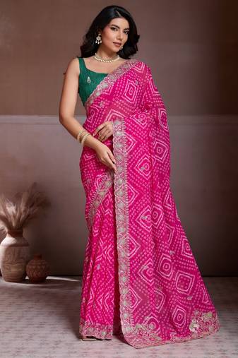 Attractive pink georgette bandhej print with cutwork lace border saree with mono banglory silk blouse