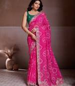 Attractive pink georgette bandhej print with cutwork lace border saree with mono banglory silk blouse