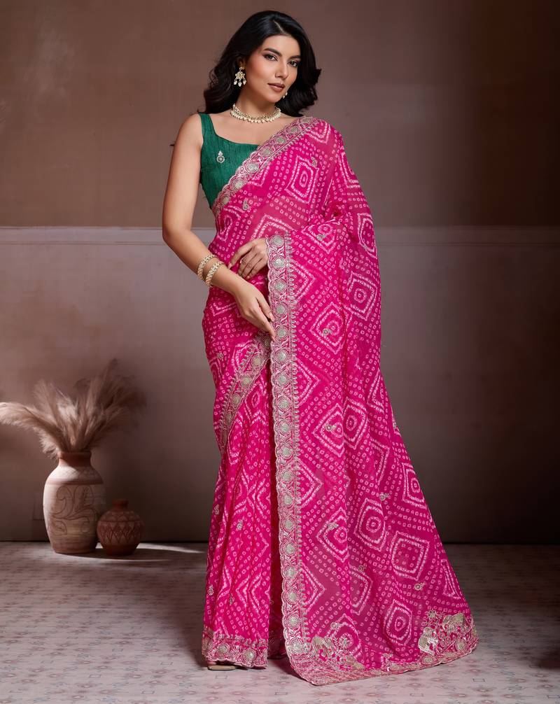 Attractive pink georgette bandhej print with cutwork lace border saree with mono banglory silk blouse