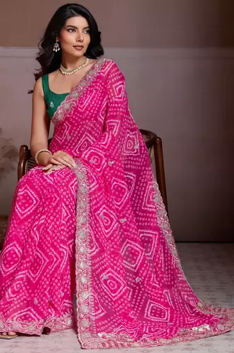Attractive pink georgette bandhej print with cutwork lace border saree with mono banglory silk blouse