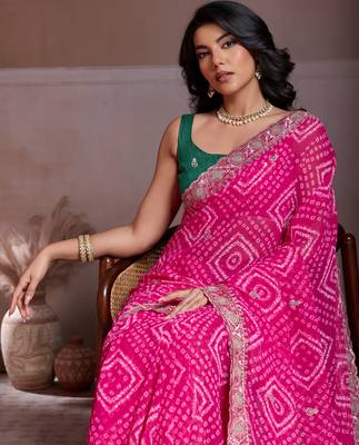 Attractive pink georgette bandhej print with cutwork lace border saree with mono banglory silk blouse 4
