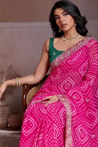 Attractive pink georgette bandhej print with cutwork lace border saree with mono banglory silk blouse