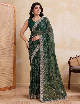 Ravishing green georgette bandhej print with cutwork lace border saree with mono banglory silk blouse 1