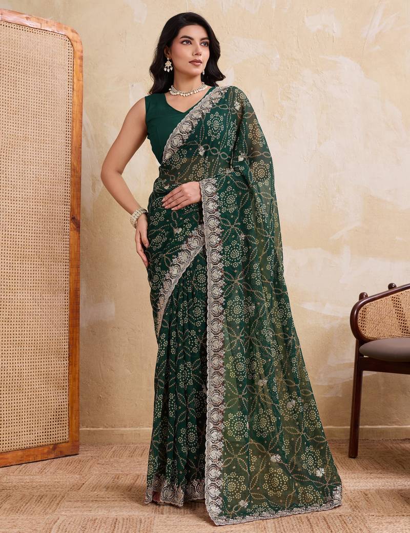 Ravishing green georgette bandhej print with cutwork lace border saree with mono banglory silk blouse