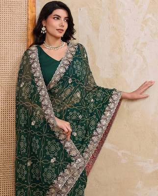 Ravishing green georgette bandhej print with cutwork lace border saree with mono banglory silk blouse 2