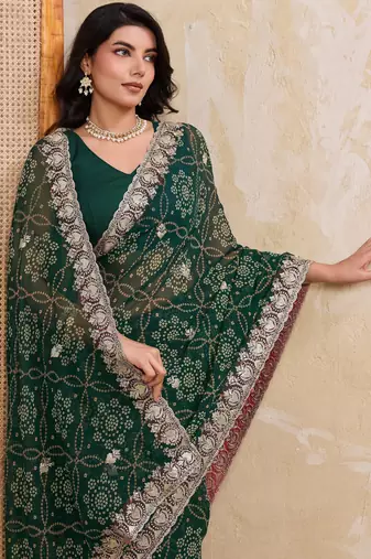 Ravishing green georgette bandhej print with cutwork lace border saree with mono banglory silk blouse