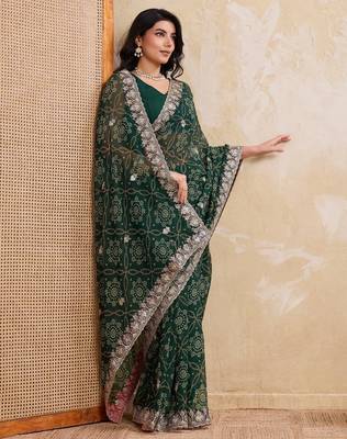 Ravishing green georgette bandhej print with cutwork lace border saree with mono banglory silk blouse 4