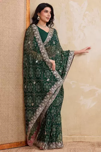 Ravishing green georgette bandhej print with cutwork lace border saree with mono banglory silk blouse