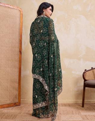 Ravishing green georgette bandhej print with cutwork lace border saree with mono banglory silk blouse 5
