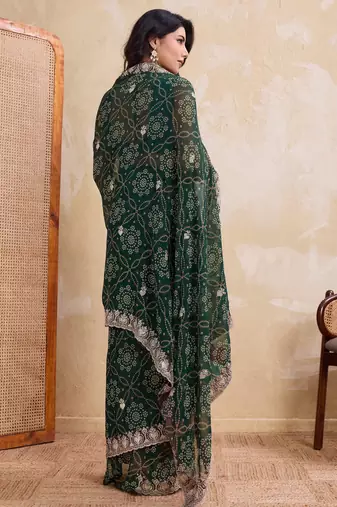 Ravishing green georgette bandhej print with cutwork lace border saree with mono banglory silk blouse