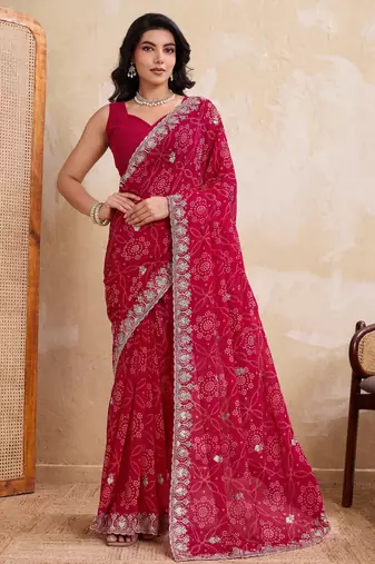 Irresistible pink georgette bandhej print with cutwork lace border saree with mono banglory silk blouse
