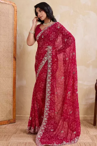Irresistible pink georgette bandhej print with cutwork lace border saree with mono banglory silk blouse