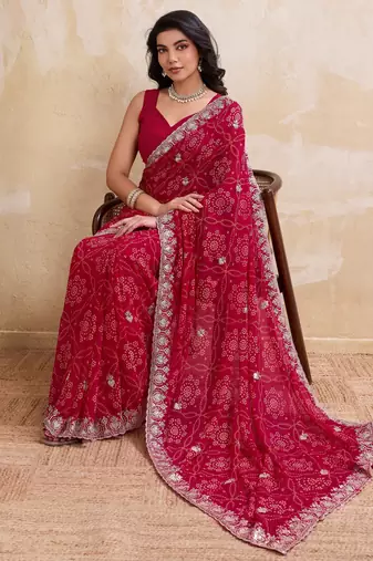 Irresistible pink georgette bandhej print with cutwork lace border saree with mono banglory silk blouse