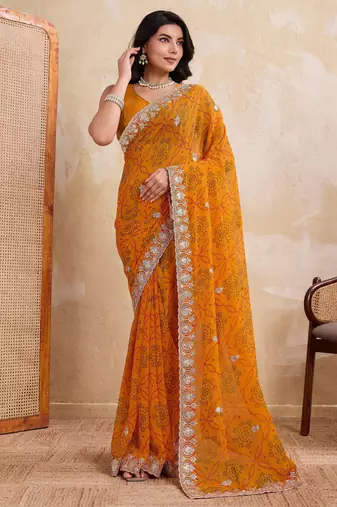 Spellbinding yellow georgette bandhej print with cutwork lace border saree with mono banglory silk blouse