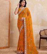 Spellbinding yellow georgette bandhej print with cutwork lace border saree with mono banglory silk blouse