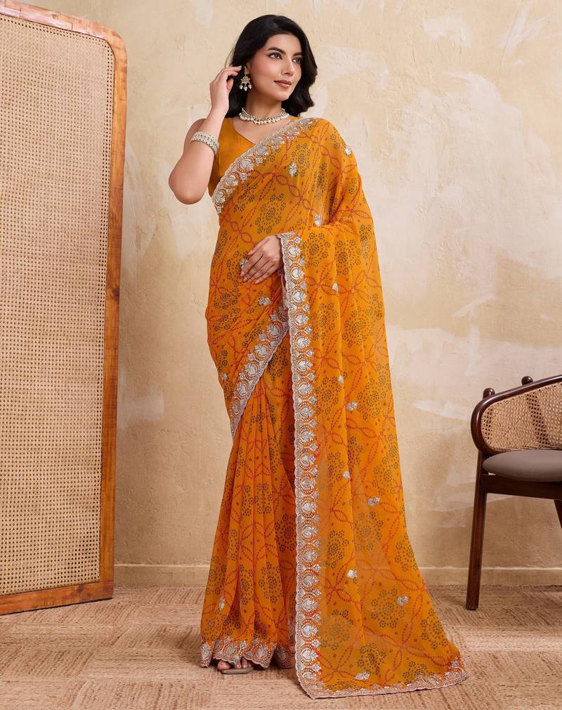 Spellbinding yellow georgette bandhej print with cutwork lace border saree with mono banglory silk blouse