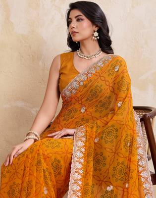 Spellbinding yellow georgette bandhej print with cutwork lace border saree with mono banglory silk blouse 2