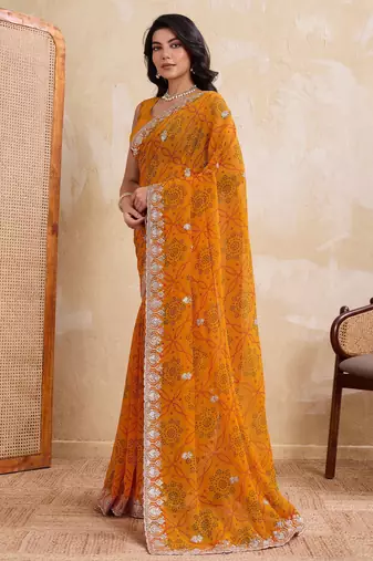 Spellbinding yellow georgette bandhej print with cutwork lace border saree with mono banglory silk blouse