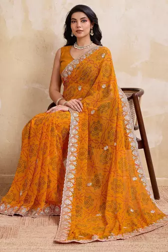 Spellbinding yellow georgette bandhej print with cutwork lace border saree with mono banglory silk blouse