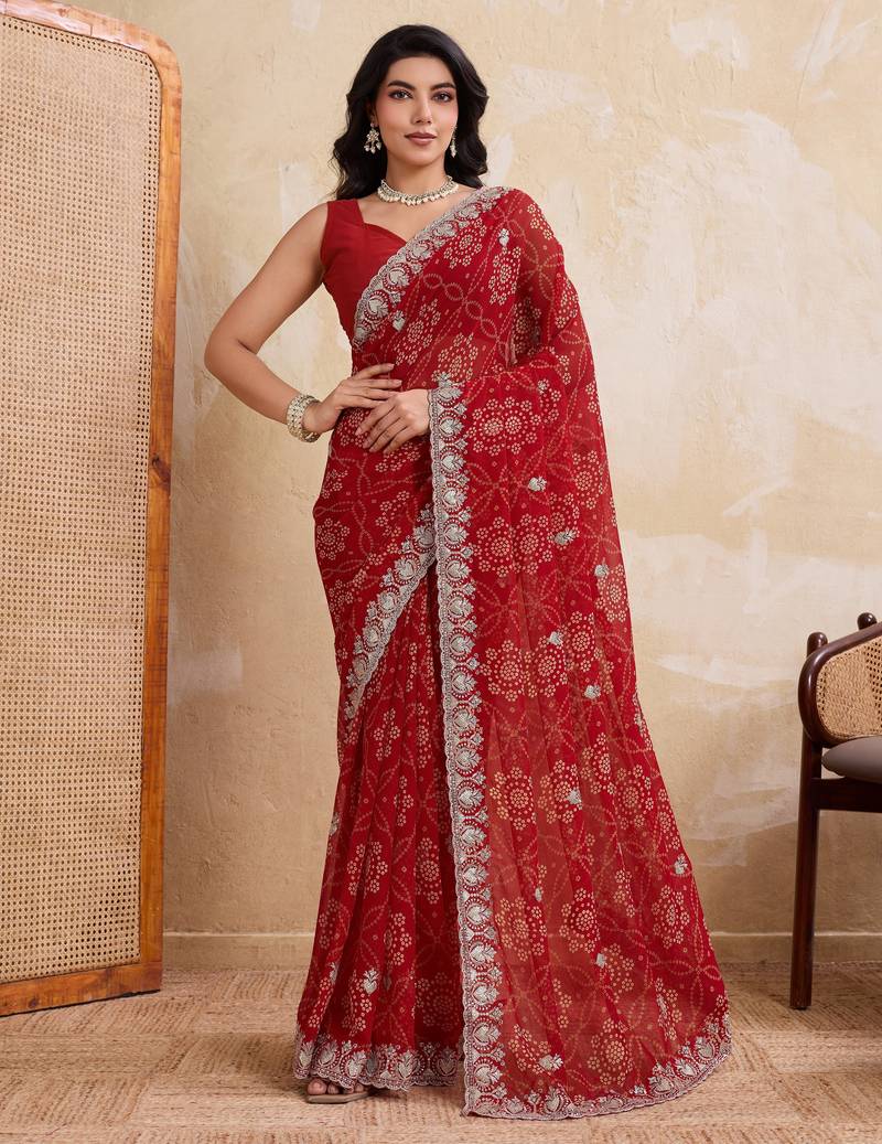 Entrancing red georgette bandhej print with cutwork lace border saree with mono banglory silk blouse
