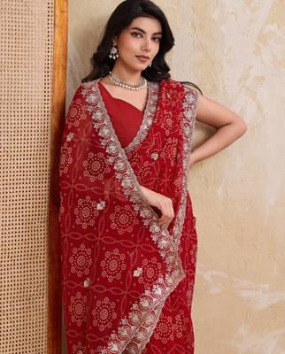 Entrancing red georgette bandhej print with cutwork lace border saree with mono banglory silk blouse 2