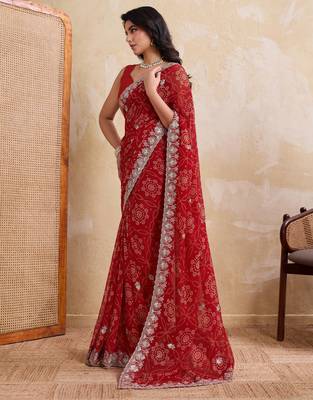 Entrancing red georgette bandhej print with cutwork lace border saree with mono banglory silk blouse 4
